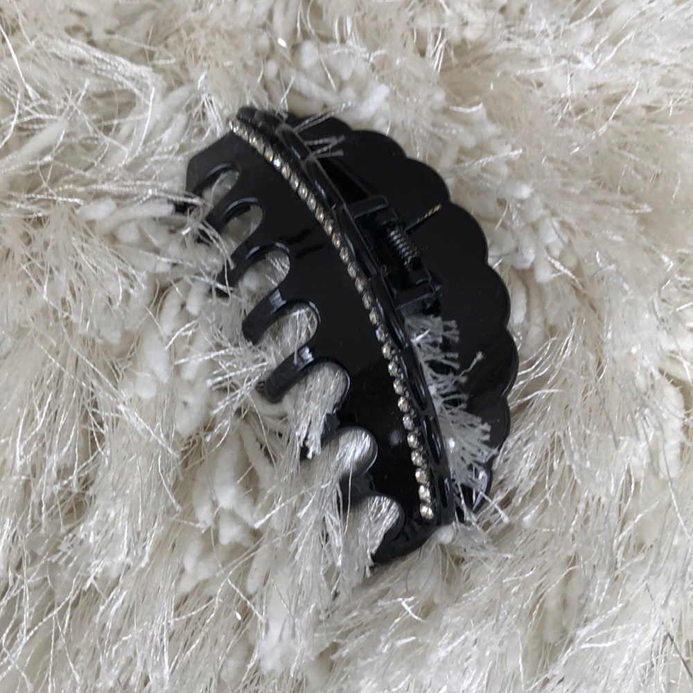 RHINESTONE CLIP ON BLACK BACKGROUND